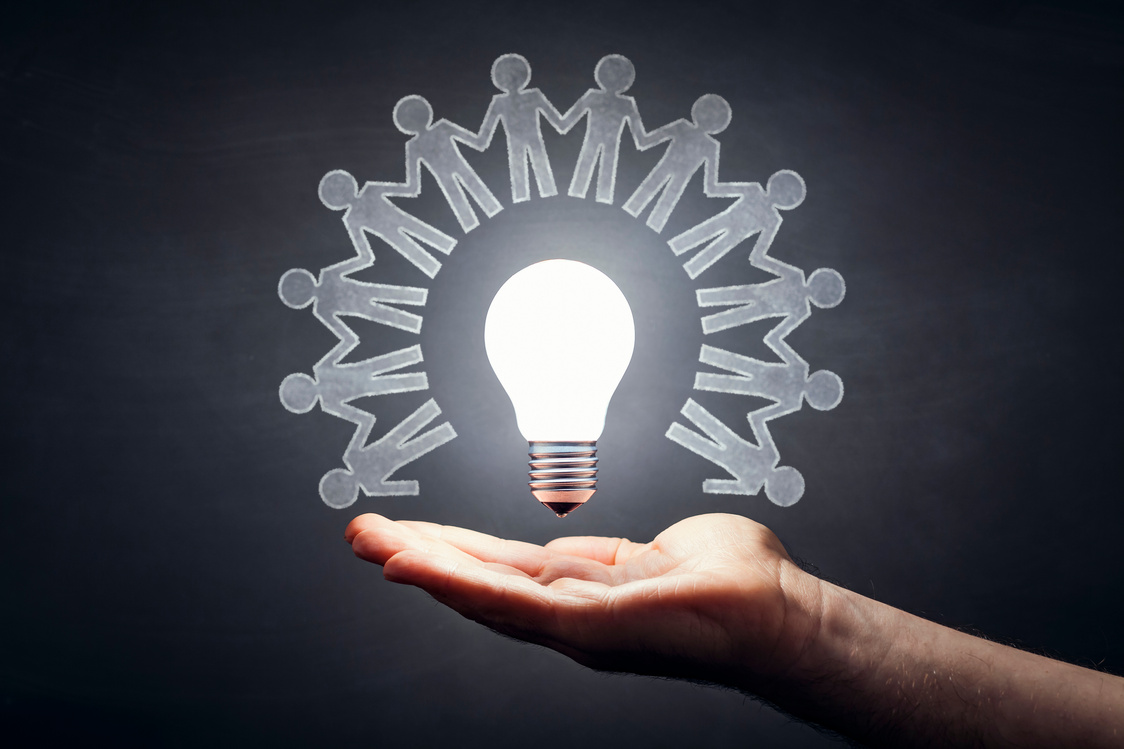 Teamwork - Light Bulb Hand Idea Blackboard People